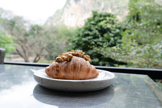 Delicious Breakfast Tearing Sweet Croissant.