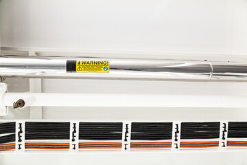 Laid new industrial electric line with wires on the ceiling.