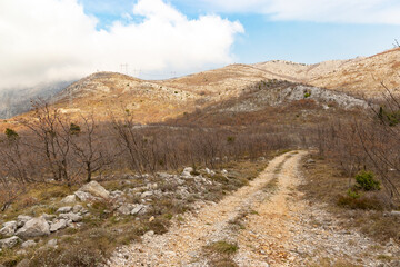 Rural road in balkan mountains. Dalmatia region, Croatia.