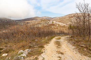Rural road in balkan mountains. Dalmatia region, Croatia.