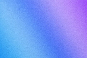Texture of old blue and purple paper background, with holographic gradient, macro. Structure of violet craft cardboard
