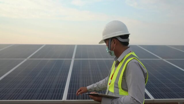Engineers working to power solar panel renewable power plants in Thailand.