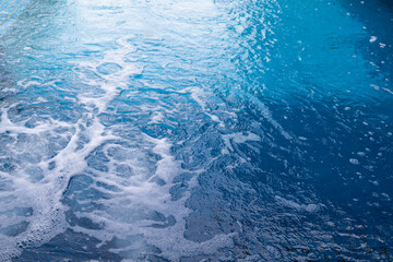 air bubbles ejected in water with a pressure generator inside the jacuzzi relax the body when...
