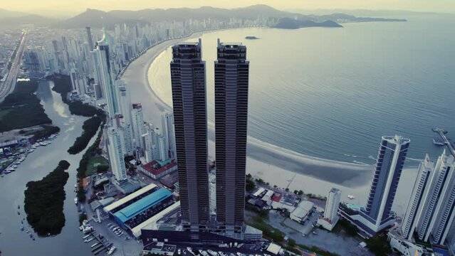 Aerial of Balne&aacute;rio Cambori&uacute;, Santa Catarina, Brazil at sunset. 4K