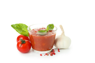 Adjika with ingredients isolated on white background