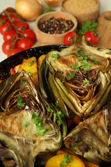 Concept of tasty food with grilled artichoke, close up
