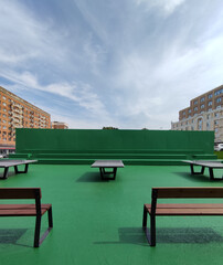 table tennis tables are on the street of the city