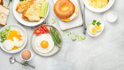 Various ways of cooking chicken eggs on light background.