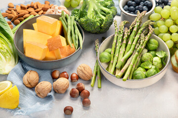 Raw and fresh vegetables and fruit on light background.