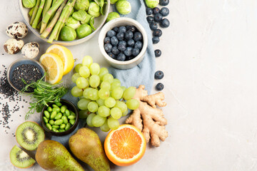 Raw and fresh vegetables and fruit on light background.