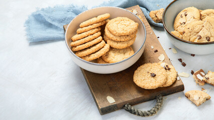 Delicious oat cookies on light background.
