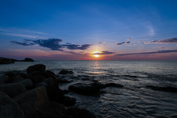 Sunset at Vivekananda rock memorial AND Thiruvalluvar statue near sea at Kanyakumari Tamilnadu South India