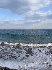 View on the stones mediterranean beach in Antalya, Turkey