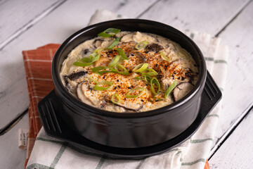 Korean steamed egg with shitake mushroom, seafood meat and onion leaks