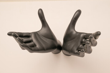 Old shabby mannequin hands on a white background