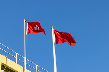 Fototapeta premium National flag of People’s republic of China and regional flag of Hong Kong Special Administrative region