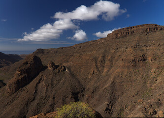 Gran Canaria, landscape of the southern part of the island along Barranco de Arguineguín steep and deep ravine
with vertical rock walls, circular hiking route visiting Elephant rock arch 
