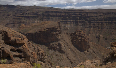 Gran Canaria, landscape of the southern part of the island along Barranco de Arguineguín steep and deep ravine
with vertical rock walls, circular hiking route visiting Elephant rock arch 
