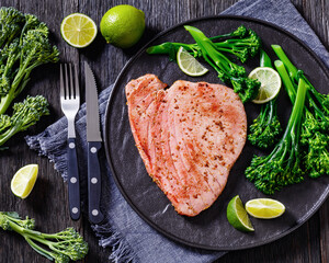 fried tuna steak with boiled broccolini and lime