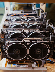 Bitcoin and cryptocurrency mineral mining computer. Close-up on five GPU