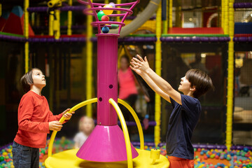 Child Plays in Play Center