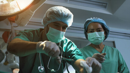 A surgeon diagnosing a senior woman's heart problem before performing a surgical procedure. Concept...