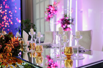 Arranged table with plates and glasses on a wedding reception