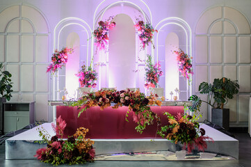 Fototapeta na wymiar Artificial flowers decoration on a wedding reception