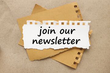 JOIN OUR NEWSLETTER text on torn white paper on brown background