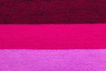 Obraz premium multi colored background. knitted wool fabric texture with stripes
