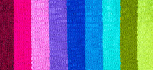 multi colored background. knitted wool fabric texture with stripes