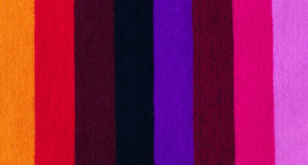 multi colored background. knitted wool fabric texture with stripes