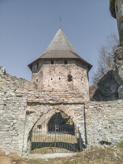 Fototapeta na wymiar The Lower Polish Gate of the 18th century is one of the entrances to the Old Town of Kamianets-Podilskyi, Ukraine. Medieval tower with gates.