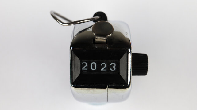 Grey counter meter with 2023 numbers, analog current meter recorder isolated on white background