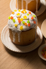Easter cakes decorated with candied fruits and jelly eggs, copy space