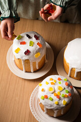 Girl decorates Easter cakes