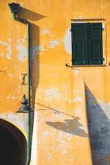 old facade of a house in the small sea village of Variotti, in Liguria, Italy