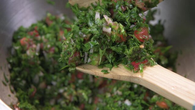Tabbouleh salad Tabouli Recipe chopped parsley. High quality 4k footage