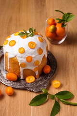 Easter cake with citrus on a wooden table