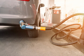 Fuel car. Pump petrol from nozzle in vehicle tank. Gasoline, oil gas station. Economy business with...