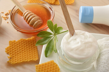 Detail of personal hygiene cosmetic products with honey on table