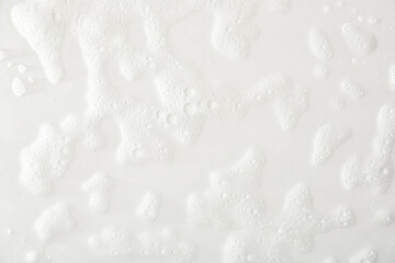 Foam texture with traces of soap and shower water top