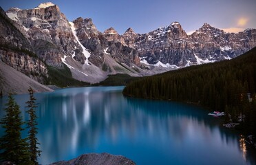 Turquise glacial lake by rocky mountains at night. Morain lake Ten peaks at nigh. Alberta. Canada