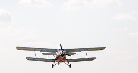 Small light airplane ready to flight on the airport field.