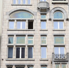 Fototapeta premium Amsterdam Damrak Street White Building Facade Detail with Balcony, Netherlands