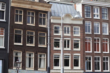 Obraz premium Amsterdam Nieuwezijds Voorburgwal Street Old House Facades Close Up, Netherlands