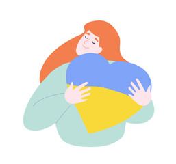 Girl hugs a heart with the colors of the flag of Ukraine.
