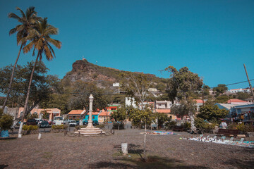 A monument in the main square of Velha, a suburb of Praia on Cabo Verde islands on a warm sunny autumn day.