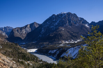 Fototapeta na wymiar Frozen lake among mountains (Vajont Valley)