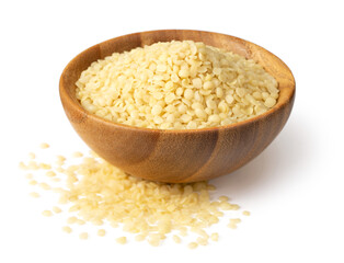 Raw hemp seeds in the wooden bowl, isolated on the white background.